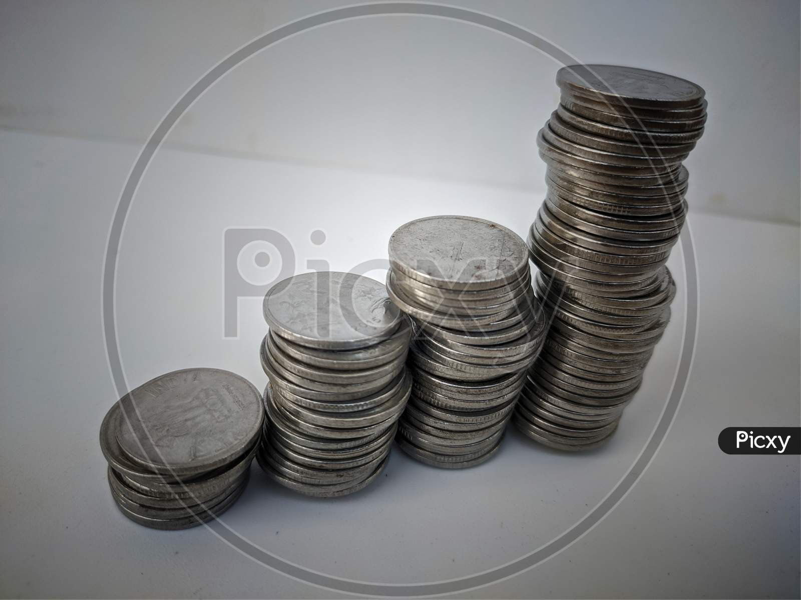 this is a picture of coins on white background.this is a collection of old coins.