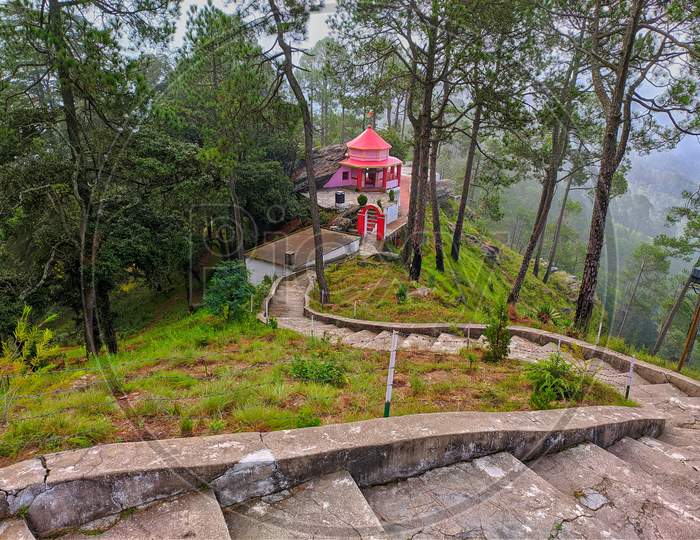 this is a picture of kasar devi temple in almora.temple in forest.