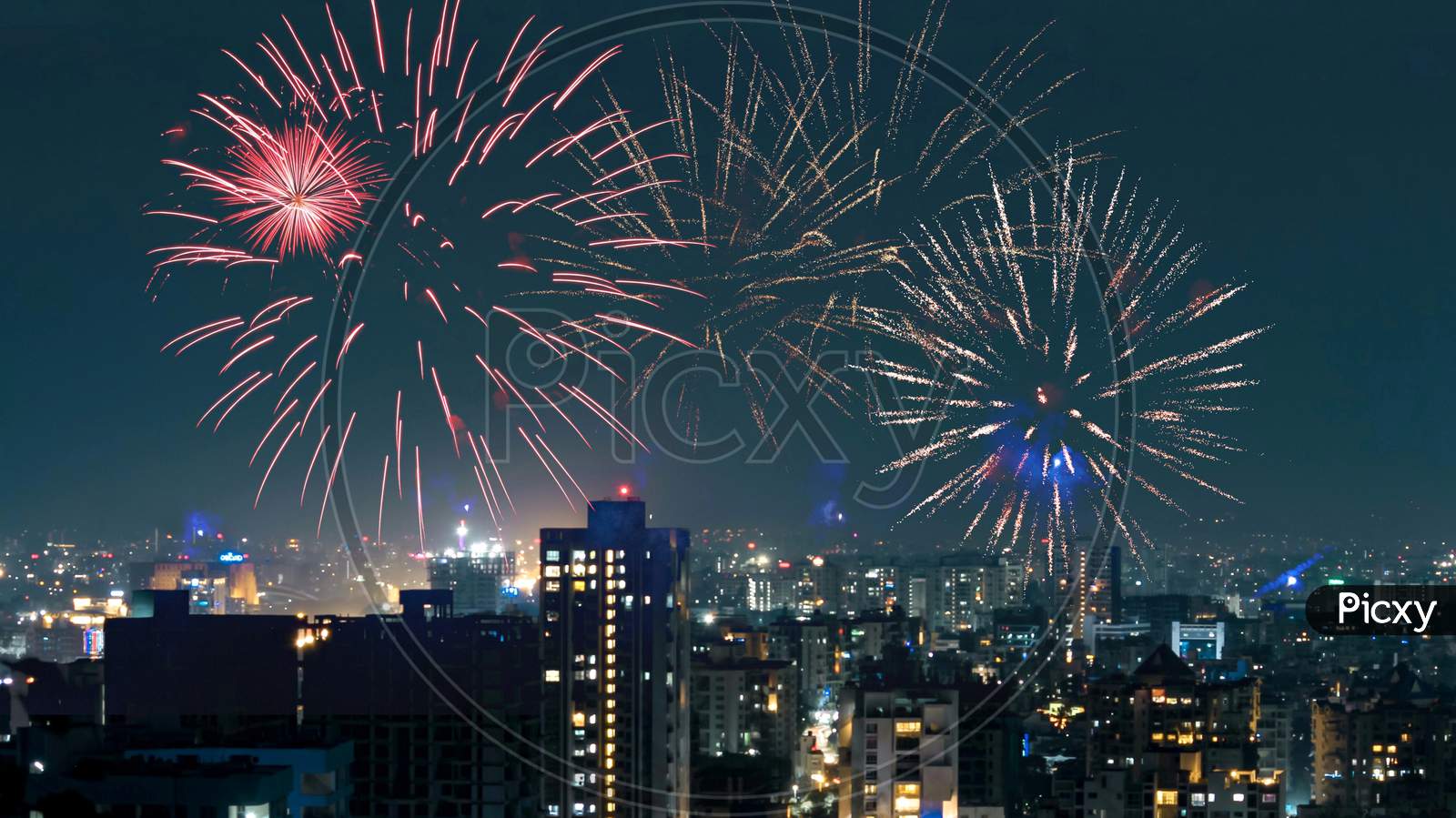 Cityscape at night and fireworks