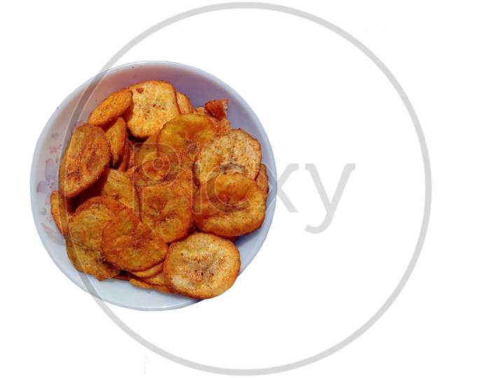 Spicy Banana chips Indian Namkeen  tasty Vegetarian snack in a white bowl.