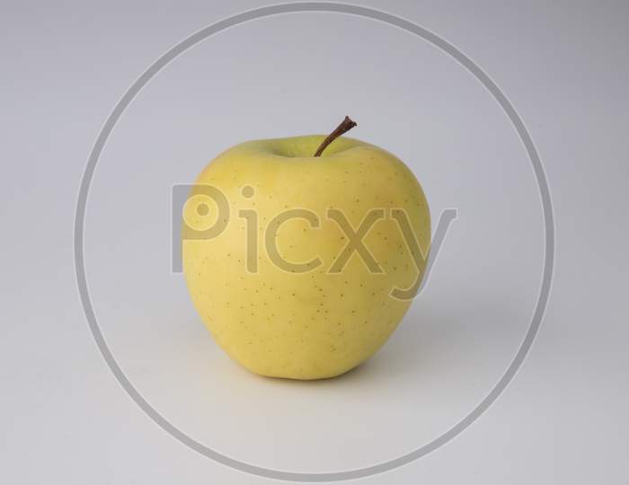 yellow apple in white background