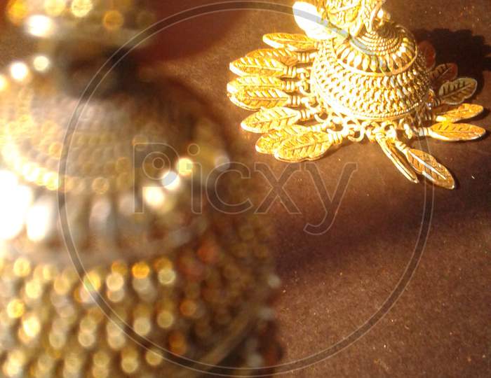 Golden jhumkas , earrings photography