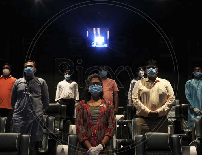 People wearing face masks as a precaution measure are seen at a movie theatre amidst the outbreak of the coronavirus disease (COVID-19), in Mumbai, India on November 15, 2020.