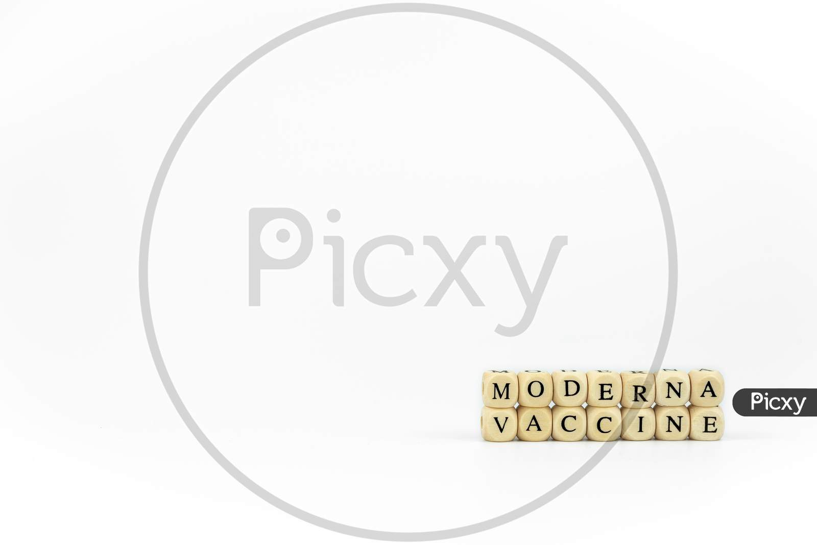 The Name Of Pharmaceutical Company Moderna Written With Wooden Letters On A White Background. Race To Find The Vaccine Against The Coronavirus Pandemic. Covid Concept.