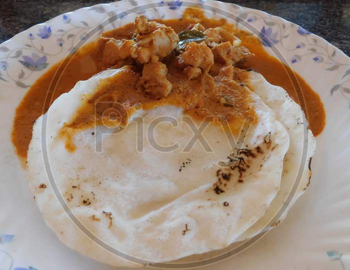 Closeup View Of Dish ( Rice Rotti With Chicken Curry)In A Plate