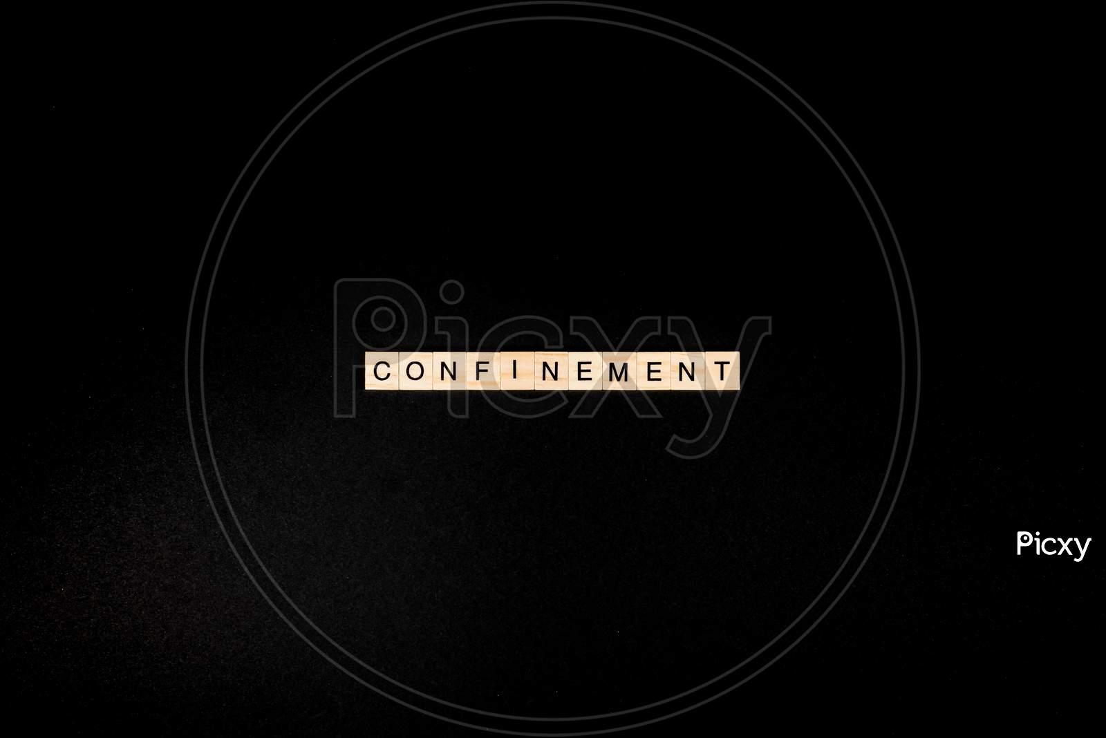 Wooden Letters On A Black Background Forming The Word “Confinement”. Second Wave During Coronavirus Pandemic Concept.