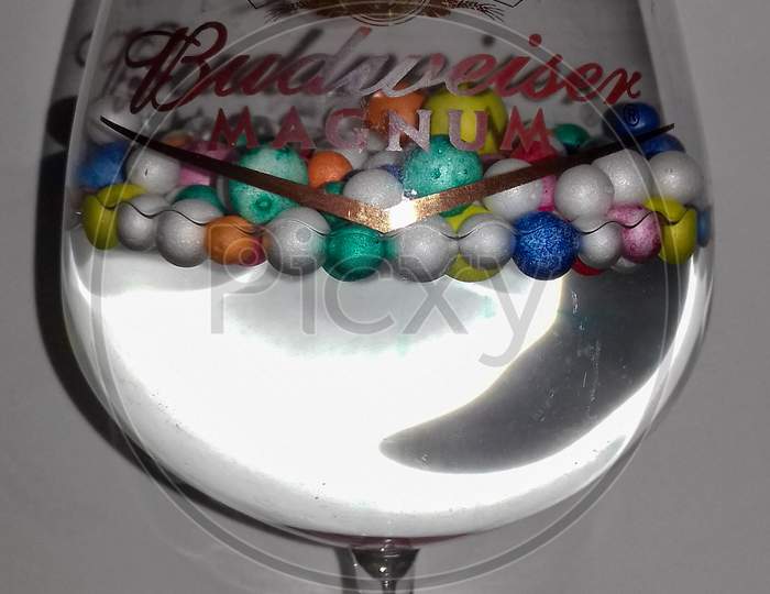 A wine glass with balls