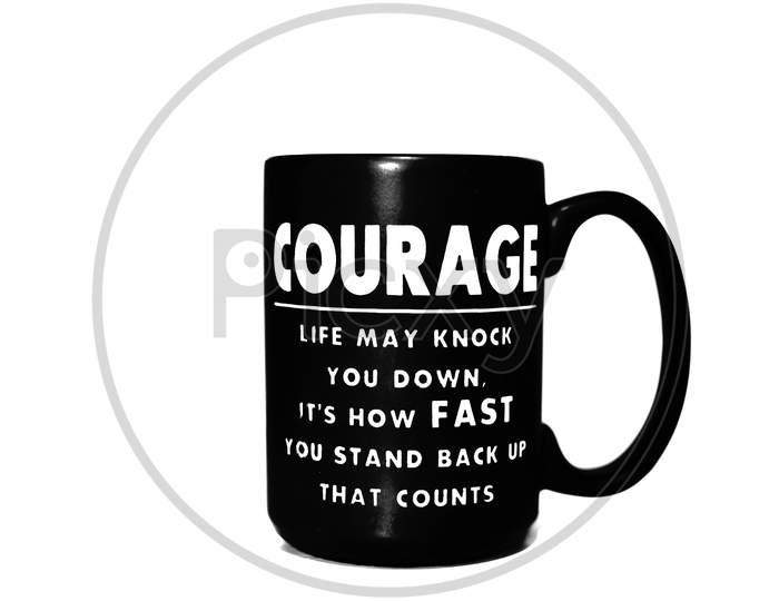 A black coffee mug with an inspirational quote written on it