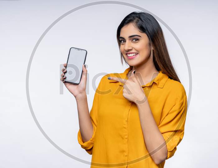 Indian young woman showing Mobile Phone