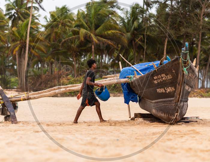 Benaulim,Goa/India- Aug 2 2020: Indian fishermen getting ready for venturing into sea for their daily catch. Indian fishing industry.