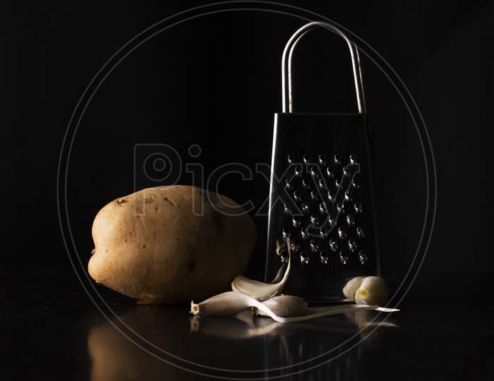 grater with potato