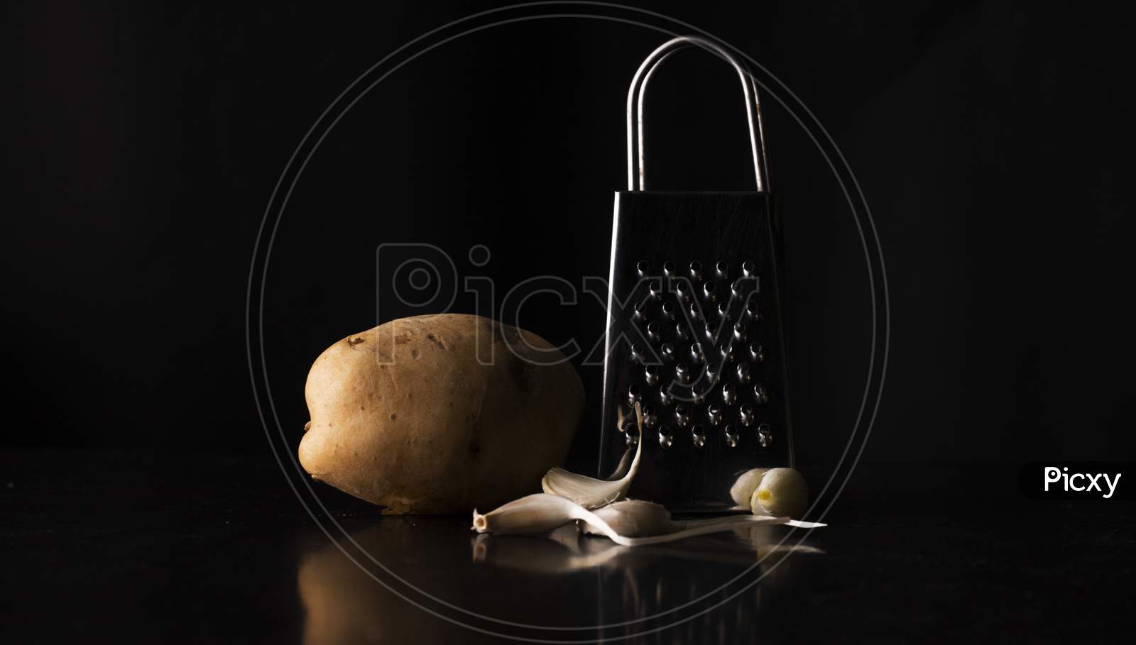 grater with potato