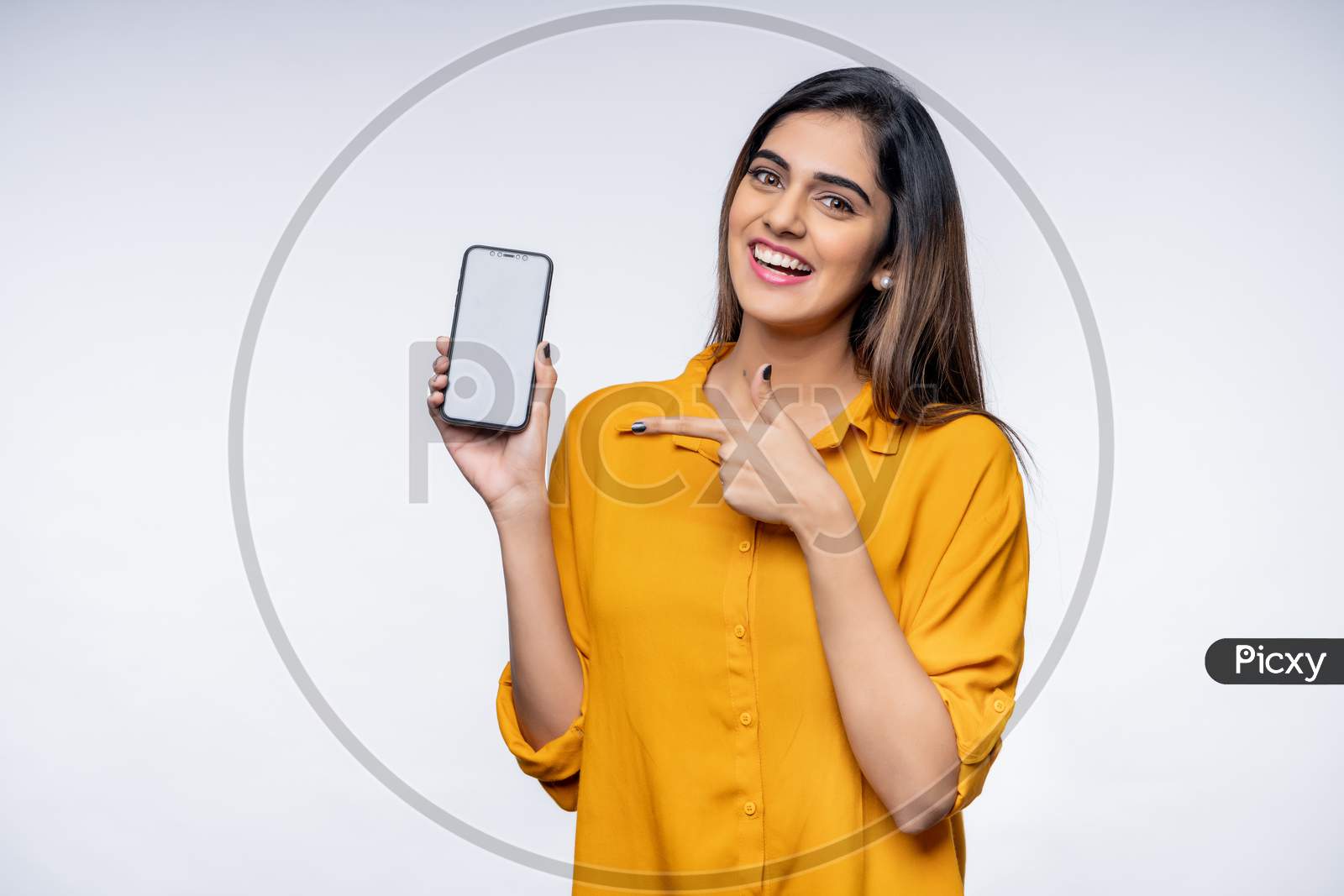 Smiling Young Indian woman showing Mobile Phone