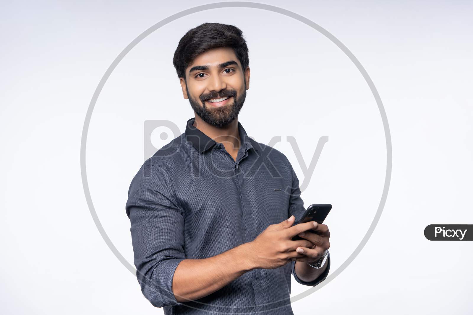 Young Indian Man using smartphone