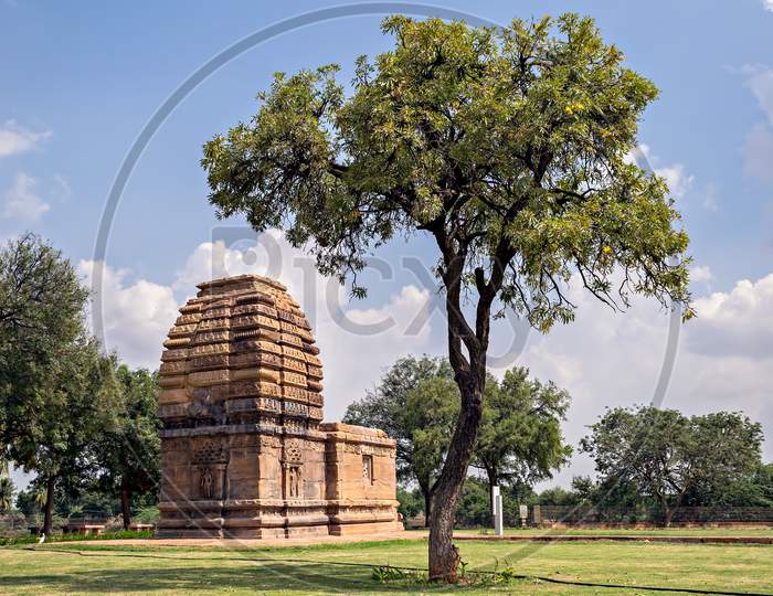 Ancient Stone Temple Monument & Tree At Pattadakal , Karnataka, India.