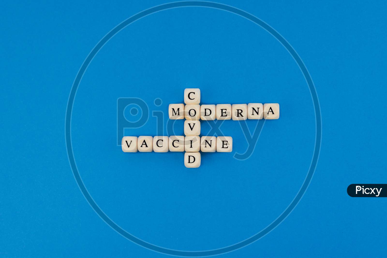 The Name Of Pharmaceutical Company Moderna Written With Wooden Letters On A Blue Background. Race To Find The Vaccine Against The Coronavirus Pandemic. Covid Concept.