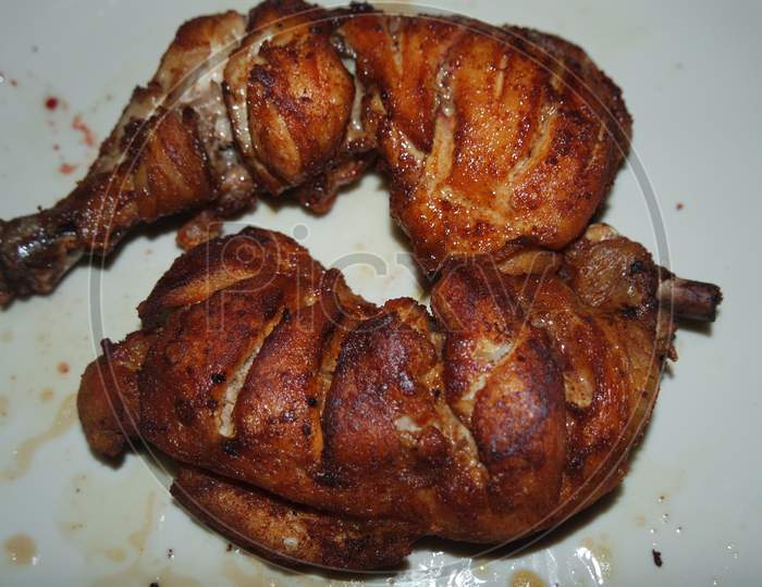 Fried, Grilled Baked Chicken Pieces With Marinated Spices On It