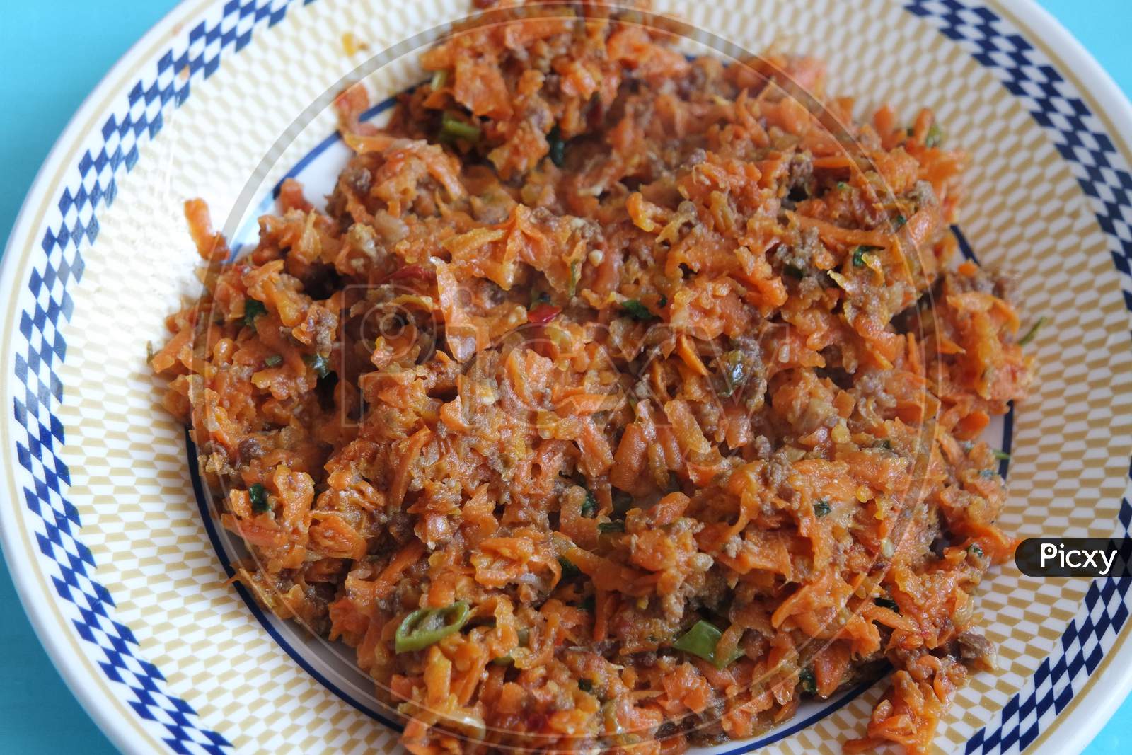 Top Closeup View Of A Homemade Dish Made From Carrot And Vegetables.