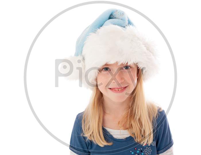 Beautiful Young Blonde Girl In Christmas Hat Looks Smiles At The Camera