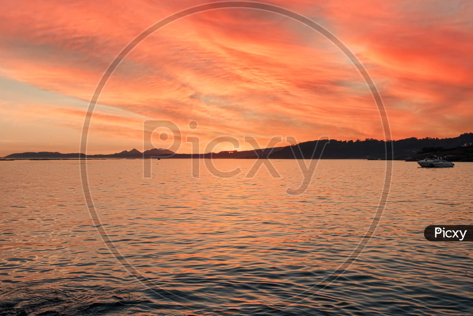 Horizon Of Some Islands Under A Colorful Sunset With A Relaxing Seascape