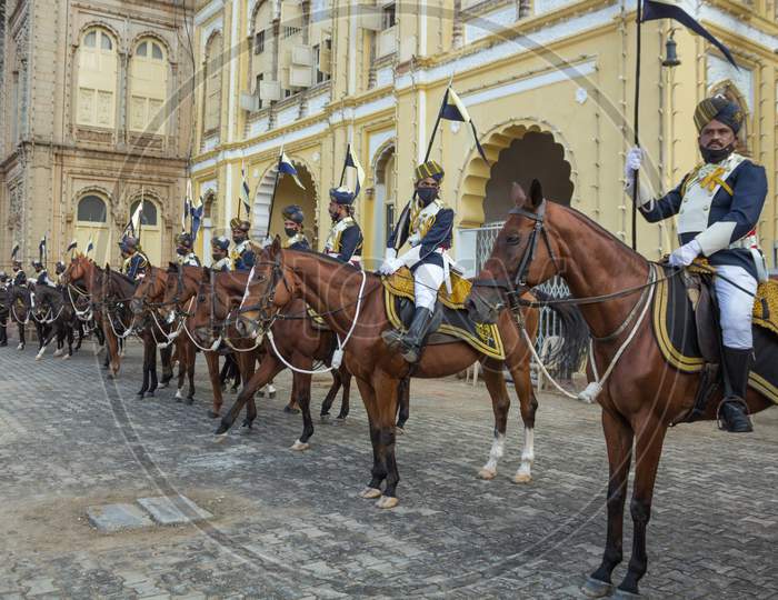 A Battery of Royal Horses lined up with their Horsemen with the Flags for the Dasara Procession at Amba Vilas Palace in Mysore of Karnataka/India.