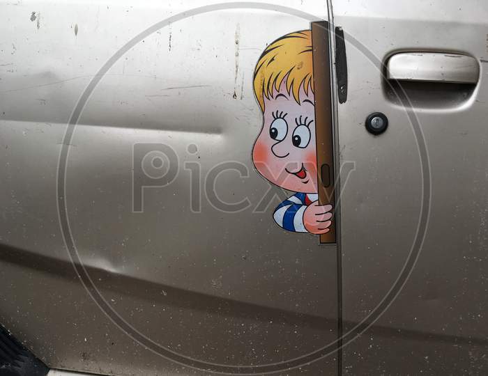 A door with fun images looking outside the car