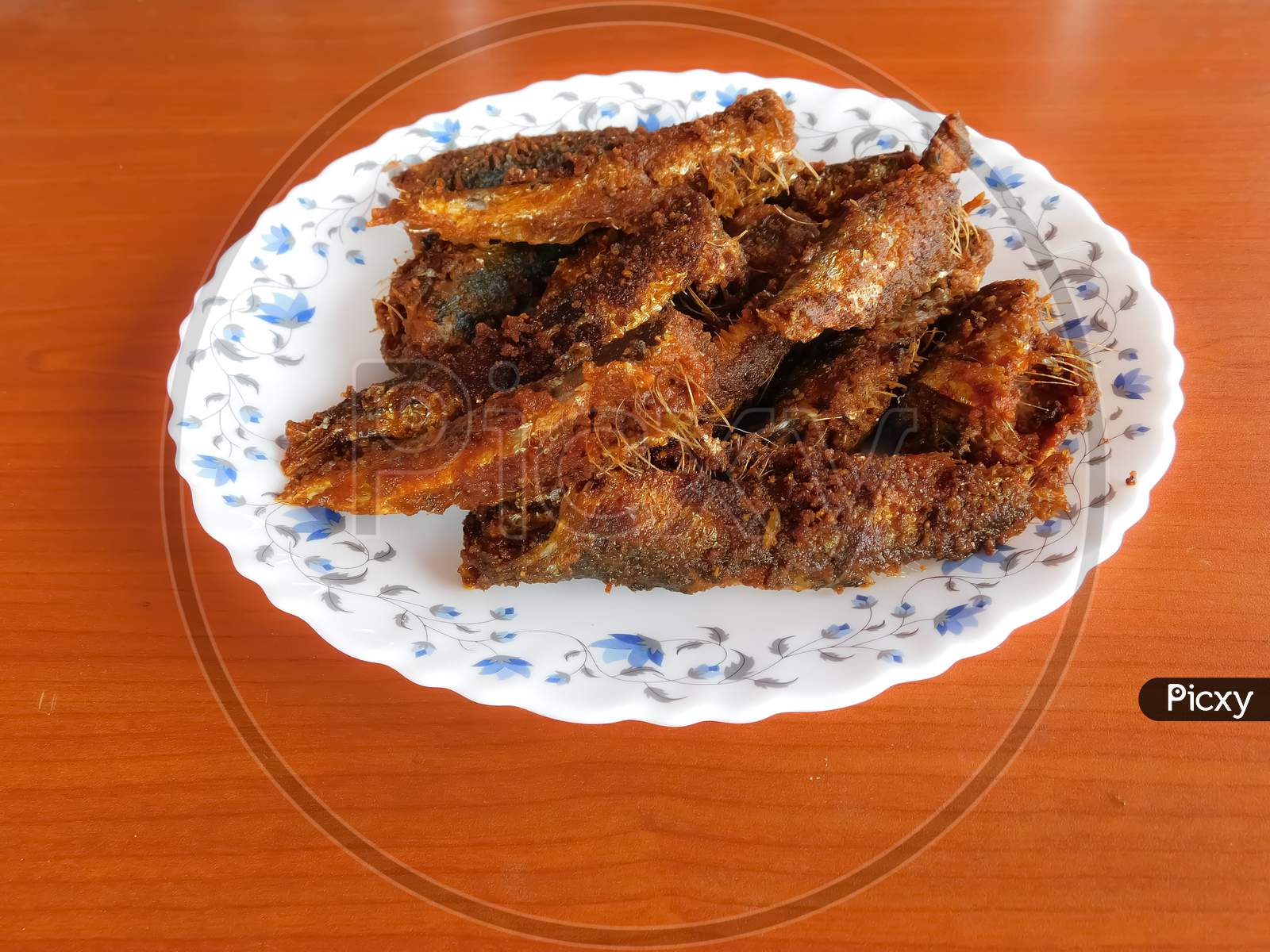 Selective Focus On Dish(Fish Fry)With A Bowl Isolated On Wooden Surface