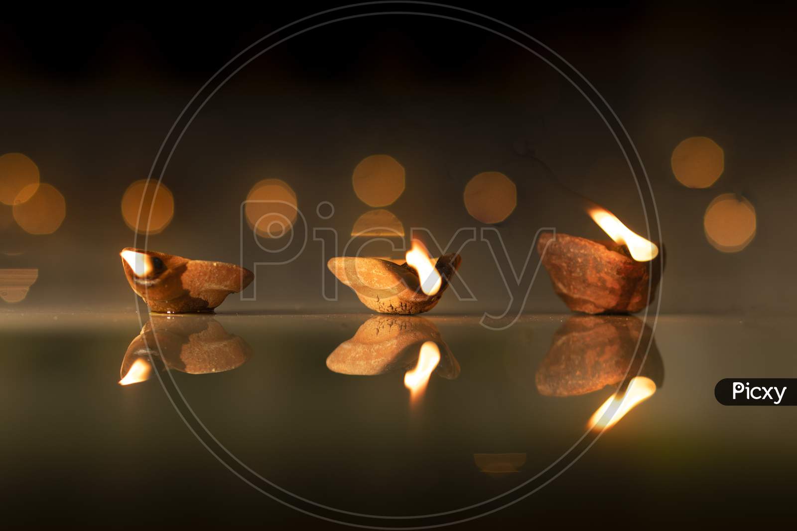Diwali Diya With golden Bokeh Light Background