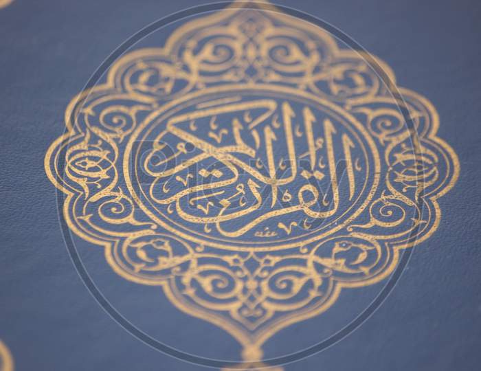 Closeup Shot Of Islamic Book Quran With Golden Arabic Calligraphy