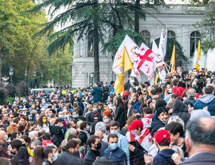 1 November, 2020. Tbilisi.Republic Of Georgia. Crowd Of People With Posters And Flags Standing In Front Of Parliament Building During Post Election Protest.