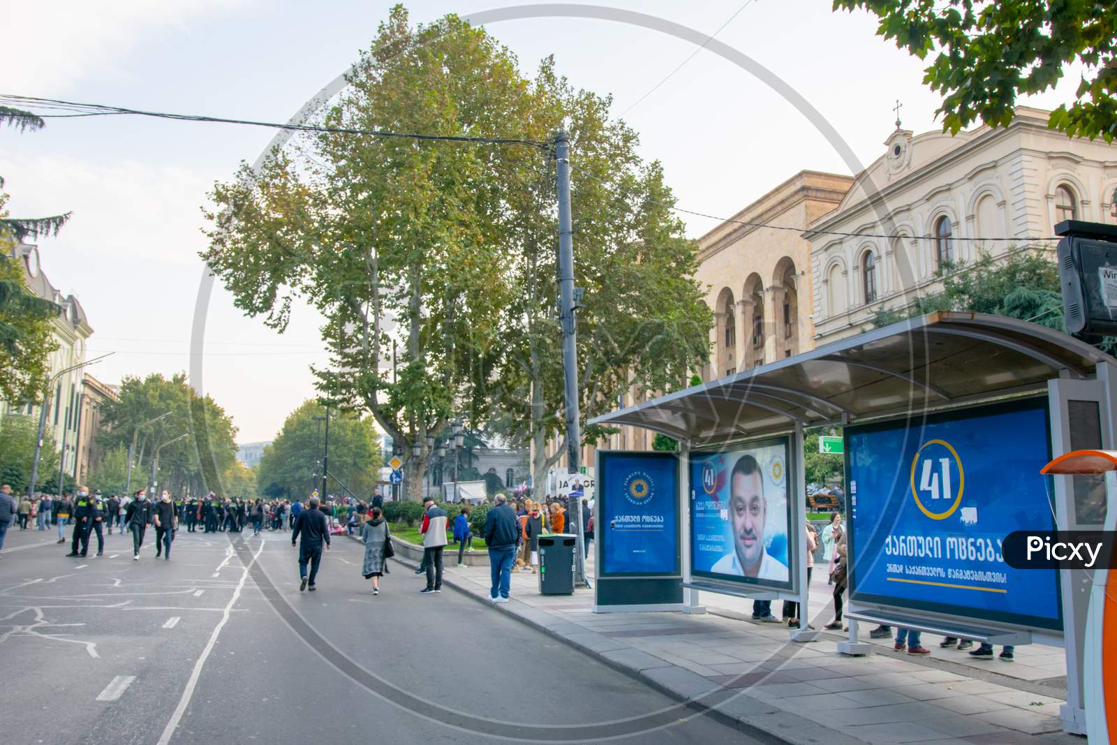 1 November, 2020. Tbilisi.Republic Of Georgia. Closed Rustaveli Avenue Street  During Protest With Blue City Bus Turning With Election Agitation On.