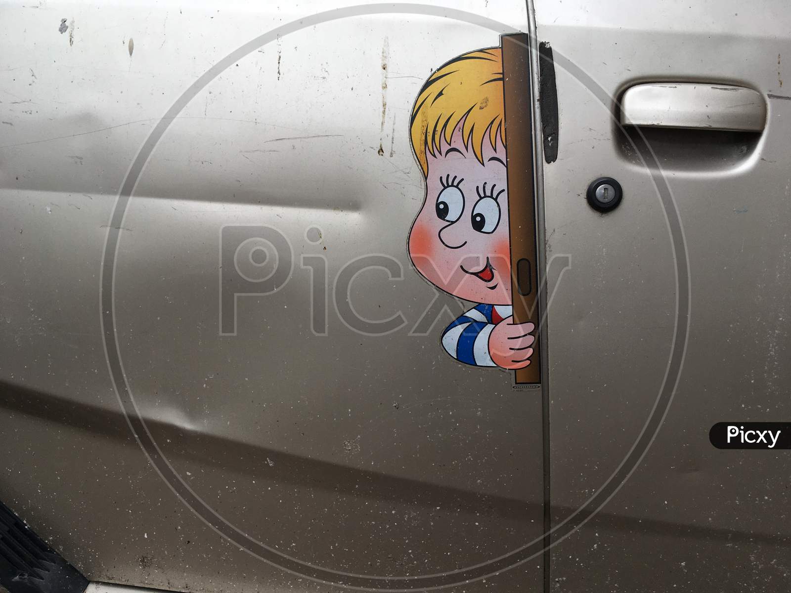 A door with fun images looking outside the car