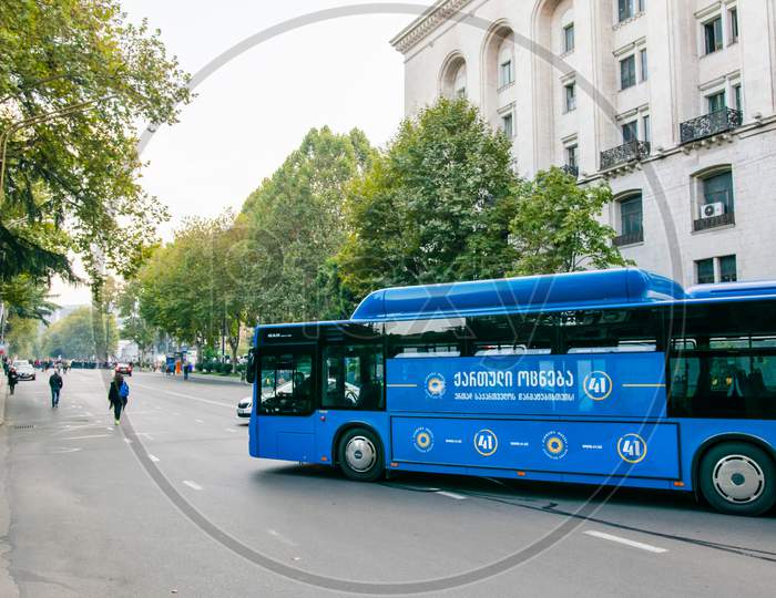 1 November, 2020. Tbilisi.Republic Of Georgia. Closed Rustaveli Avenue Street  During Protest With Blue City Bus Turning With Election Agitation On.