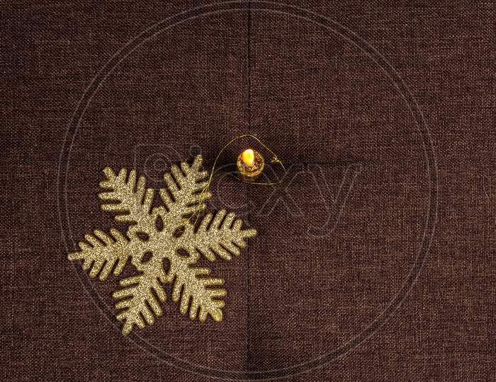 Gold Color Shiny Snowflake And Candle