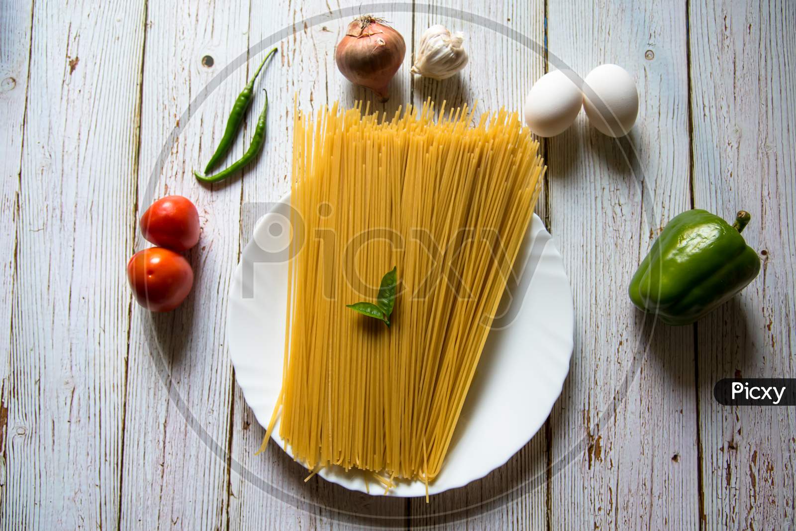 Raw food ingredient spaghetti pasta in a plate