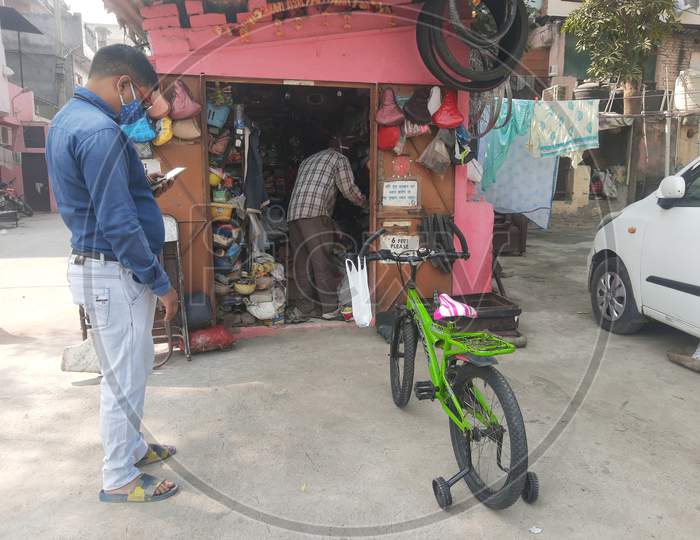 Cycle Mechanic Do Repairing Work At His Roadside Shop