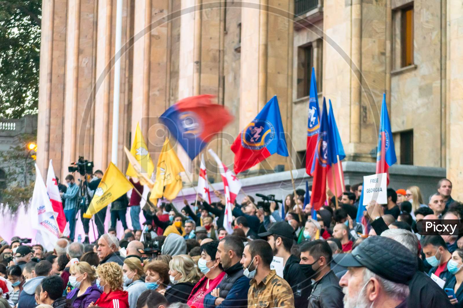 1 November, 2020. Tbilisi.Republic Of Georgia. Crowd Of People With Posters And Flags Standing In Front Of Parliament Building During Post Election Protest.