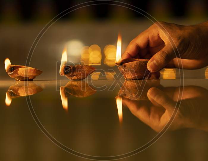 Diwali Pradip on hand With Bokeh Light Background