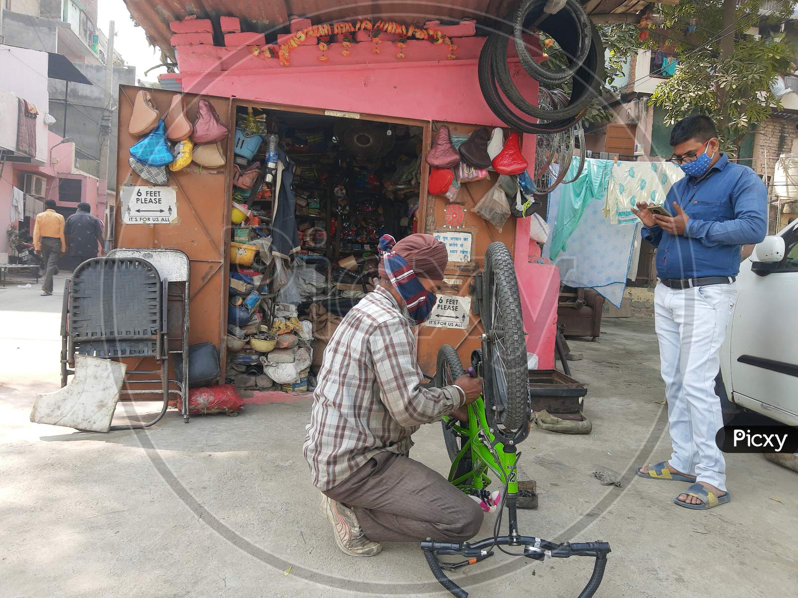 Cycle Mechanic Do Repairing Work At His Roadside Shop