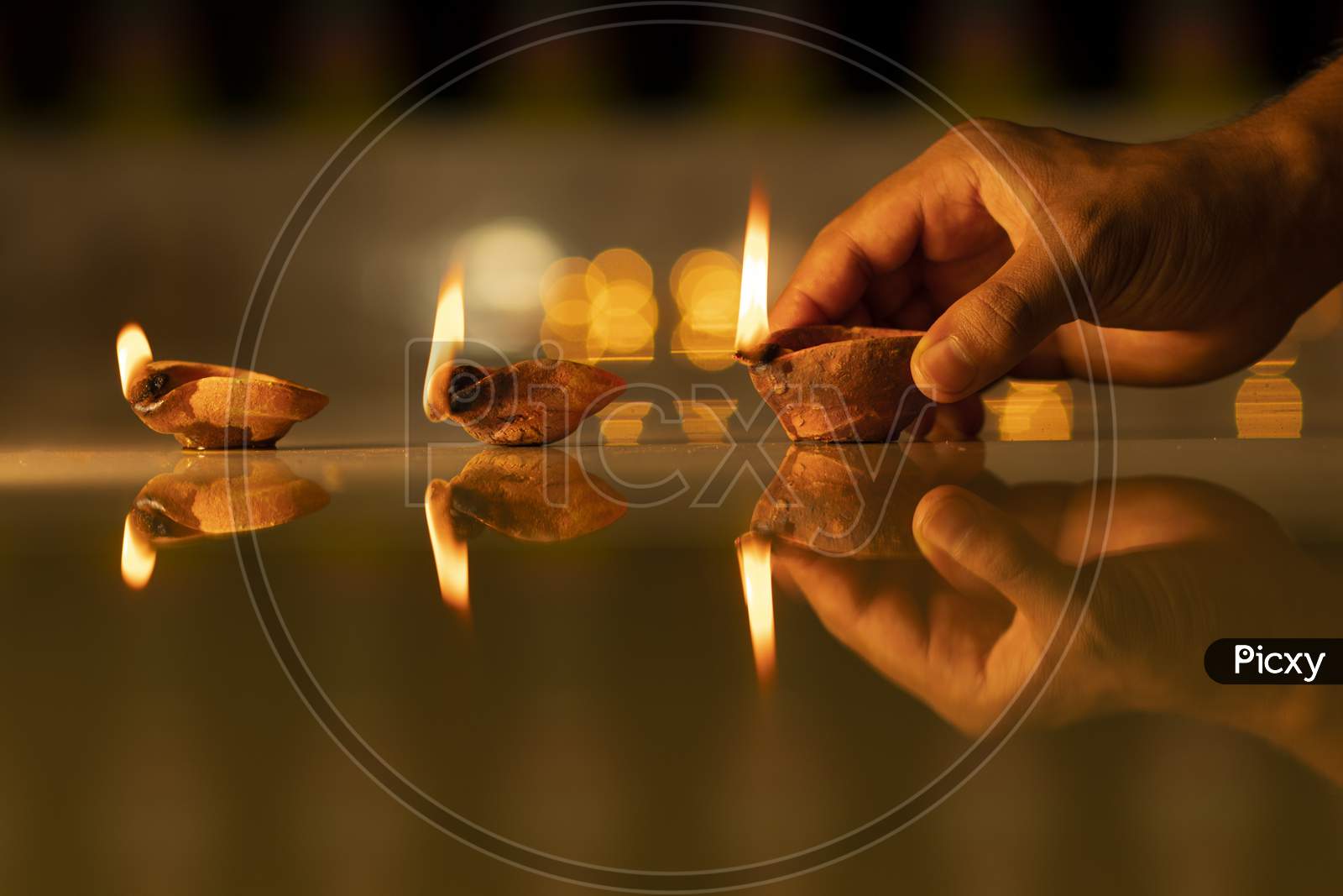 Diwali Pradip on hand With Bokeh Light Background