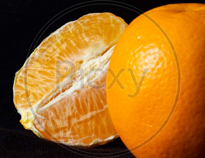 orange with skin and peeled