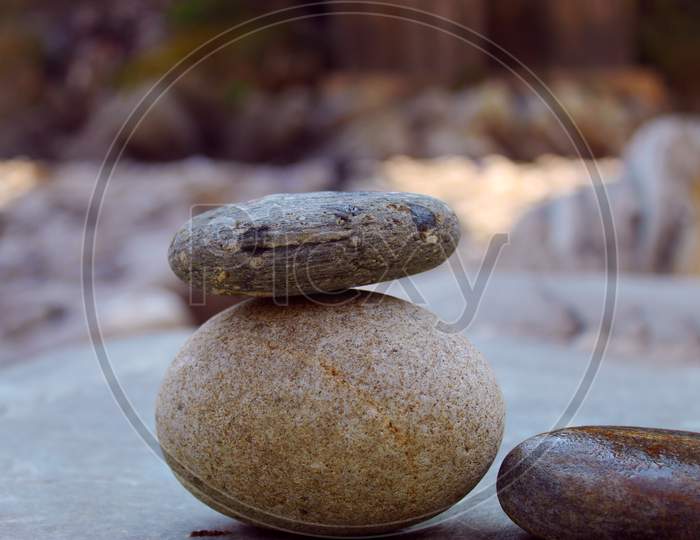 Stack of pebbles on rock. riverside stones.