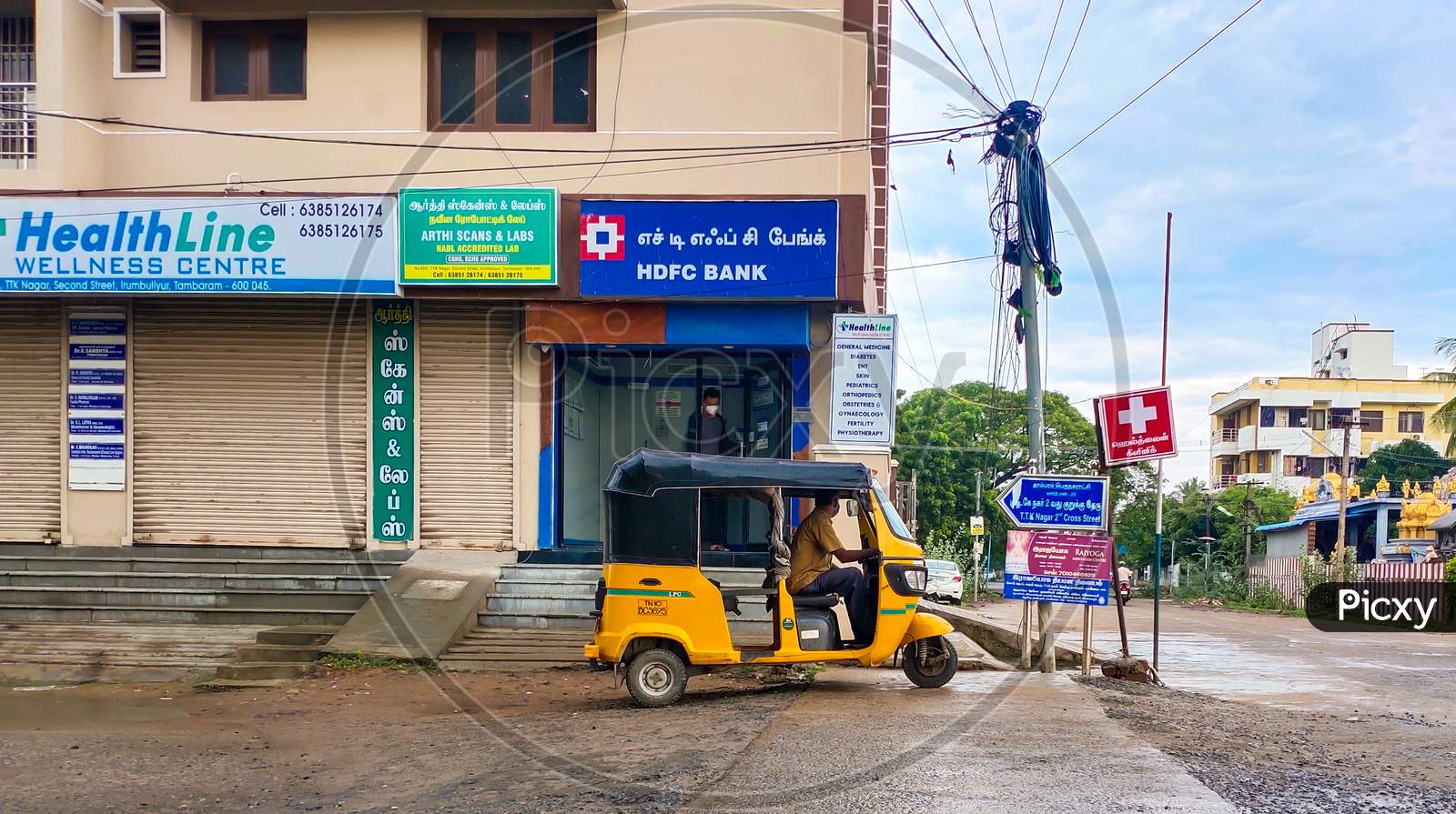Chennai, India - ‎14‎ July ‎2020: Men Coming Out From Hdfc Atm And Auto Driver Waiting Outside Of Atm For Him To Pickup & Drop .Safety Withdraw Money From Atm .