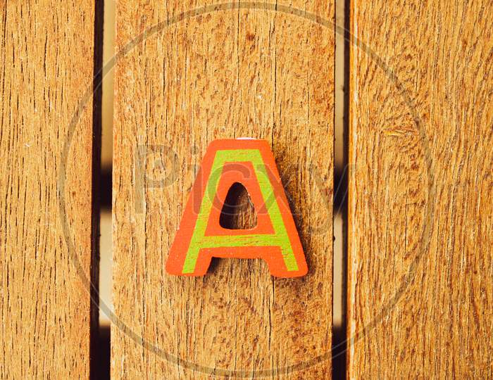 A  Letters On Wood Background