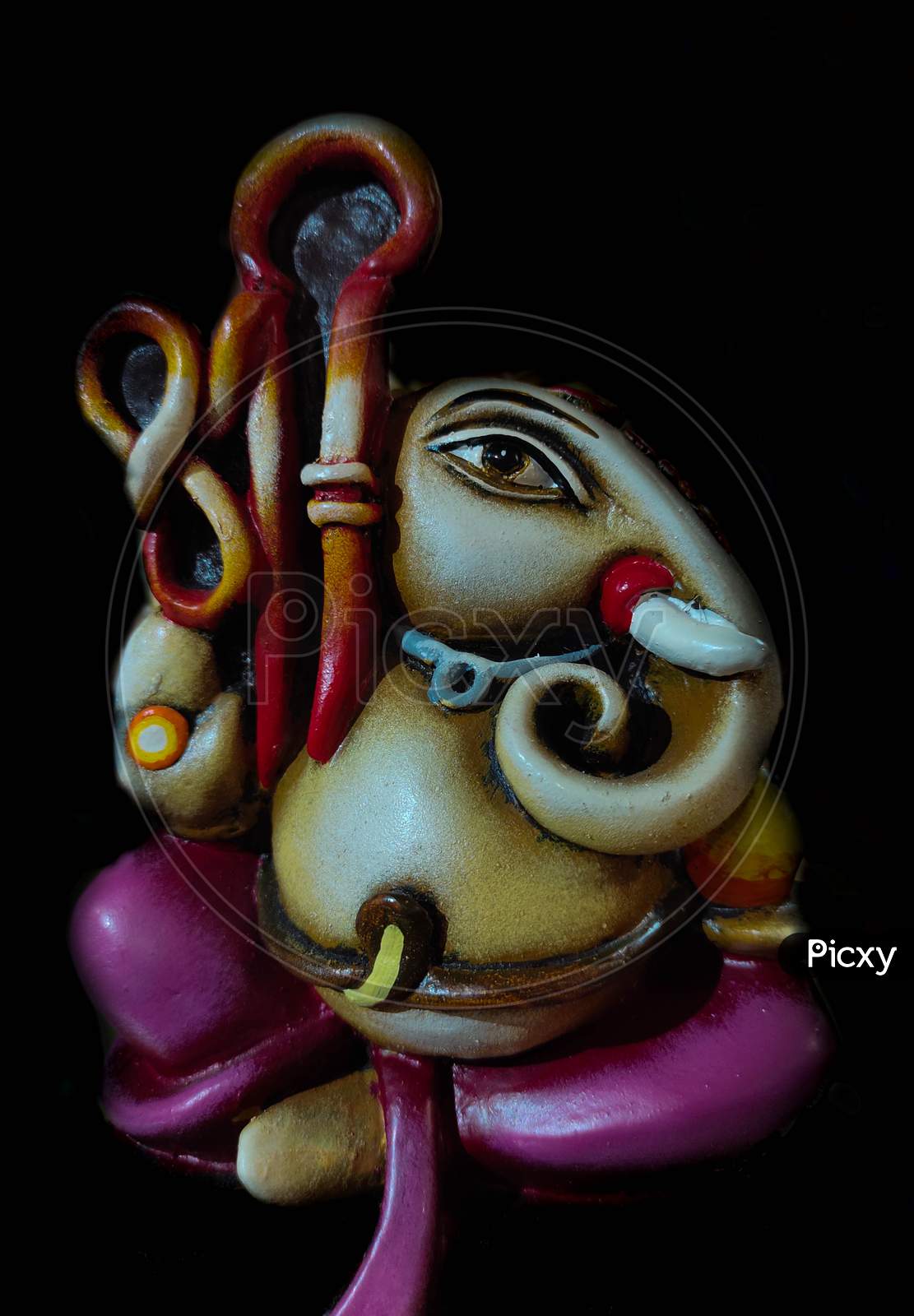 Hindu God Ganesh On Black Wooden Background. Statue On Table With  Sandalwood Stick Close Up With Copy Space For Text Stock Photo, Picture and  Royalty Free Image. Image 119066988.