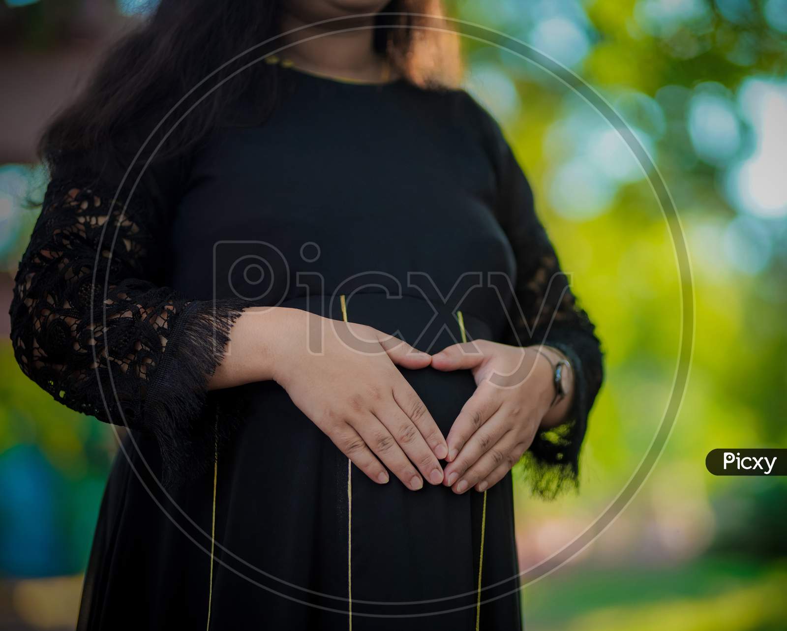 Pregnant Women Hands On Bump