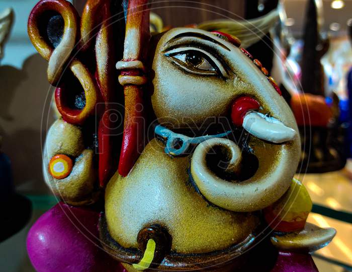 Beautiful And Colorful Artistic Figurine Of Lord Ganesha, Hindu God. Elephant Head Deity.