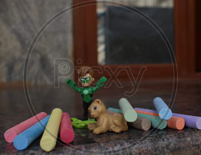 Colorful chalks & Superhero toy