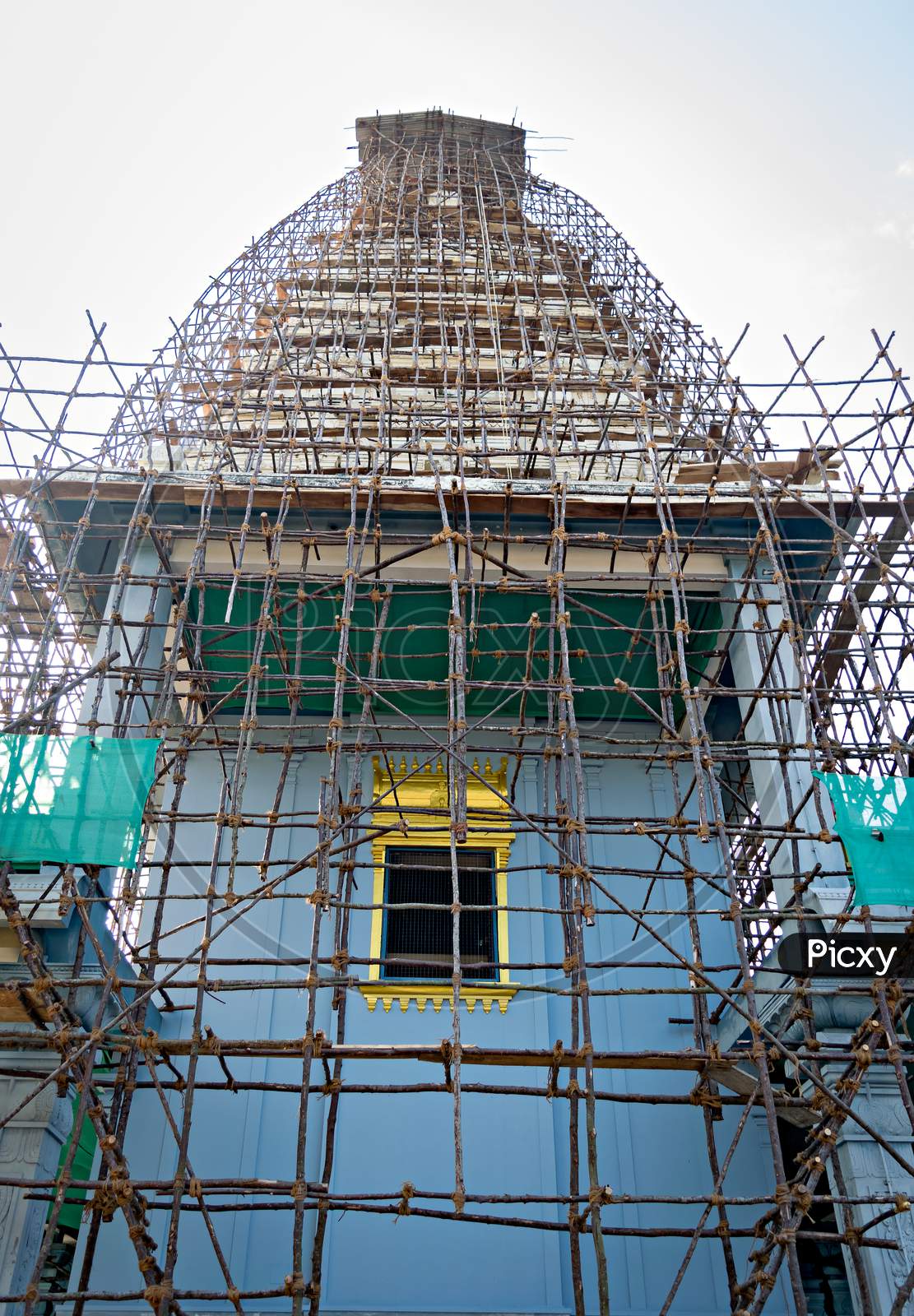 South Indian Temple Covered With Bamboo Cage Erected For Painting Work.