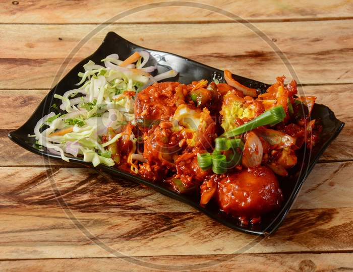 Egg Manchurian Served On Rustic Wooden Background